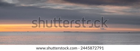 beautiful seascape with clouds over the sea, natural minimalistic background and texture, panoramic view banner. pastels tones