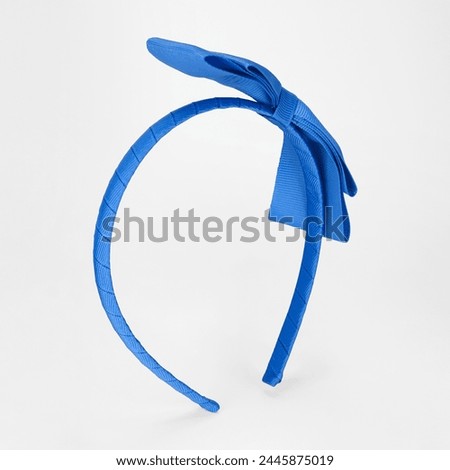 The headband is isolated on a white background. 
flexible bendable headband, the hair holder.
