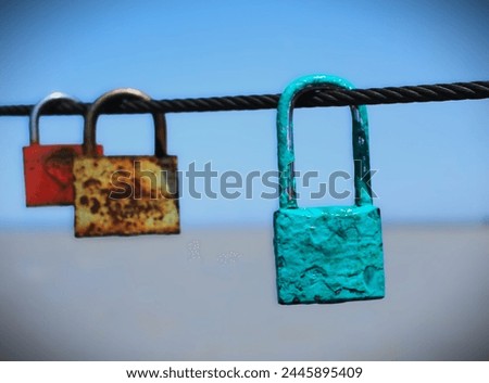 Padlocks, sometimes engraved with the names or initials of love-struck couples, representing eternal love