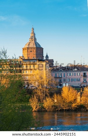 Panorama of Ponte Coperto (covered bridge) and Duomo di Pavia (Pavia Cathedral) in Pavia at sunny day, Lombardy, italy.Vertical photo.