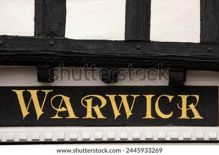The place name of Warwick, on the exterior of a building in the beautiful market town of Warwick in Warwickshire, UK.
