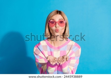 Photo portrait of pretty young girl sunglass celebrate party send air kiss wear trendy pink outfit isolated on blue color background