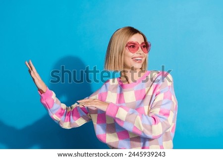 Photo portrait of pretty young girl sunglass celebrate party dancing wear trendy pink outfit isolated on blue color background