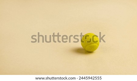Candy in the form of a yellow tennis ball. Royalty-Free Stock Photo #2445942555