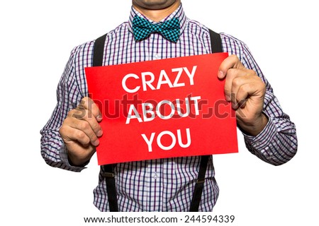 Crazy about you card isolated on white background man in bow tie hipster holding a board