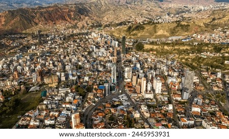 La Paz, Bolivia, aerial view flying over the dense, urban cityscape. San Miguel, southern distric. South America Royalty-Free Stock Photo #2445953931