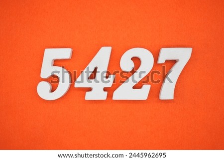 Orange felt is the background. The numbers 5427 are made from white painted wood.