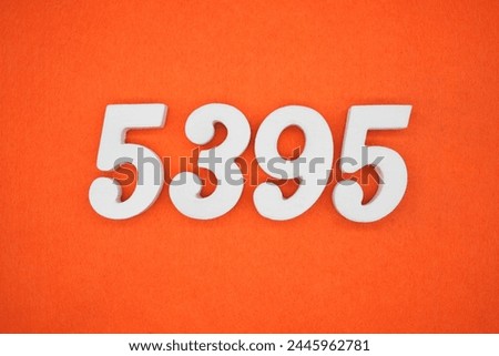 Orange felt is the background. The numbers 5395 are made from white painted wood.