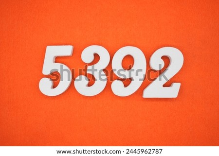 Orange felt is the background. The numbers 5392 are made from white painted wood.