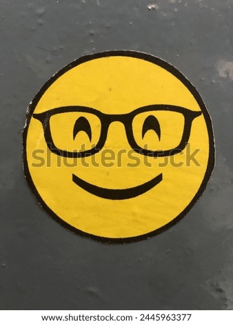a used sticker emoji on wall painting area