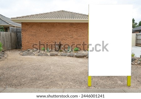 a blank, white mockup background of a stand-alone sign or board, for real estate advertising outside a single-story brick house in an Australian suburban neighbourhood. House for sale or lease.
