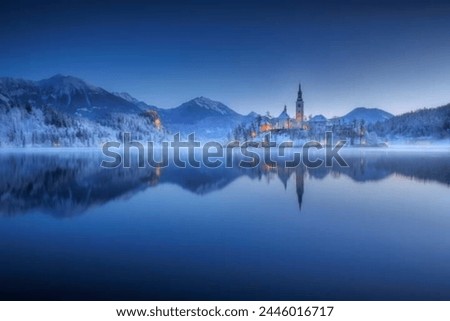 Mesmerizing reflections of the stunning Bled Castle shimmer on the calm waters of Lake Bled, creating a picture-perfect scene of tranquility and beauty.