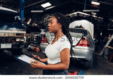 Portrait of woman Auto mechanic are repair mechanical part and maintenance auto engine is problems at car repair shop.