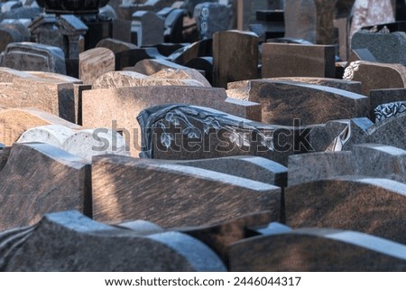 Many gravestones are for sale from a stonemason Royalty-Free Stock Photo #2446044317