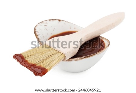 Marinade in gravy boat and basting brush isolated on white Royalty-Free Stock Photo #2446045921