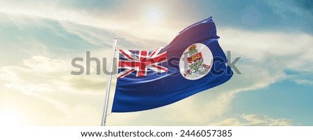 Cayman Islands national flag waving in the sky.