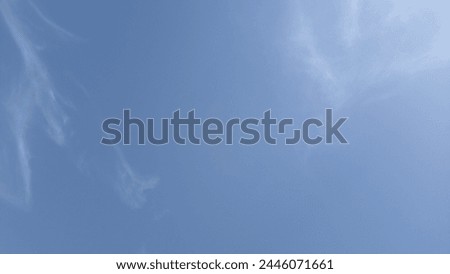 a beautiful clear blue sky and slightly cloud in there too Royalty-Free Stock Photo #2446071661