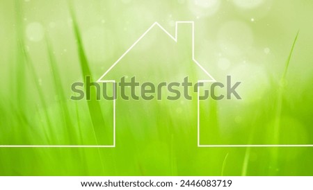 House icon drawing on blurry green bokeh grass copy space background.