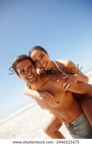 Vacation, portrait and couple piggy back at the beach with love, hug and support together on holiday in summer. Laugh, sea and happy with smile and bonding by water with travel in Miami with people