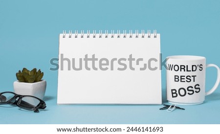 boss day assortment blue background with empty notepad