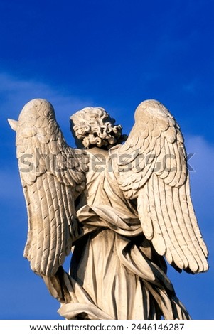 Statue of an angel by Bernini, Ponte Sant' Angelo, Rome, Lazio, Italy, Europe Royalty-Free Stock Photo #2446146287