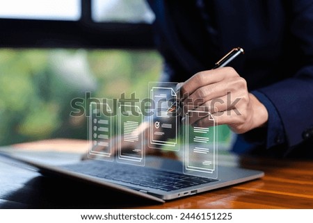 businessman manages data document files digital electronic on a laptop. concept Enterprise Resource Planning system or ERP is software for management recorded in a Database. business paperless