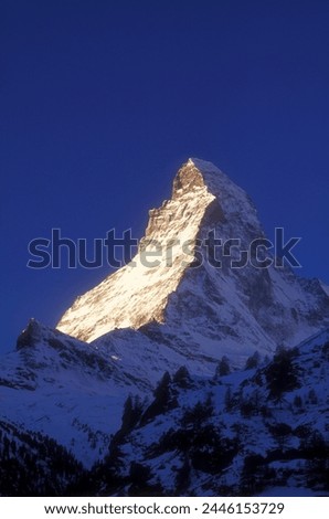 Matterhorn illuminated at sunrise, Zermatt, Valais, Switzerland, Europe