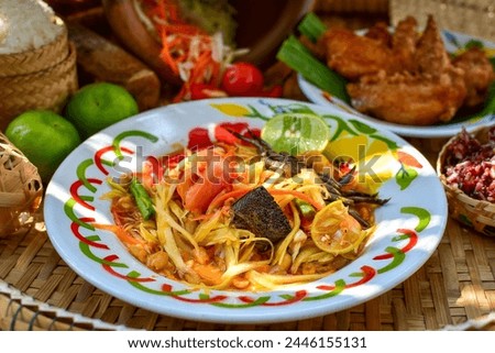 Sticky rice, papaya salad, Som Tam , thai food, isan food,Thai isan kitchen,Long bean salad,Long bean thai spicy salad Royalty-Free Stock Photo #2446155131