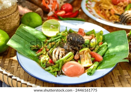 Sticky rice, papaya salad, Som Tam , thai food, isan food,Thai isan kitchen,Long bean salad,Long bean thai spicy salad Royalty-Free Stock Photo #2446161775