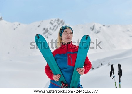 Conquering the Peak: Confident Skier Celebrates Success