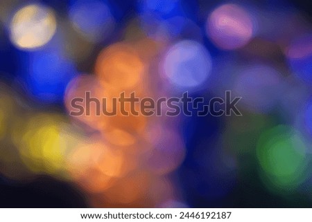 Defocused neon glow. Overlay of light highlights. Futuristic LED illumination. Blur of colors on dark abstract background