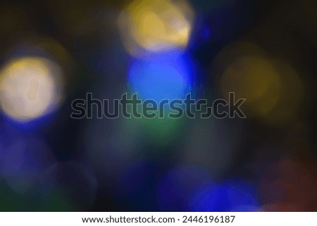 Defocused neon light. Overlaying highlights. Futuristic abstract LED backlight. Blur of neon colors on dark abstract background