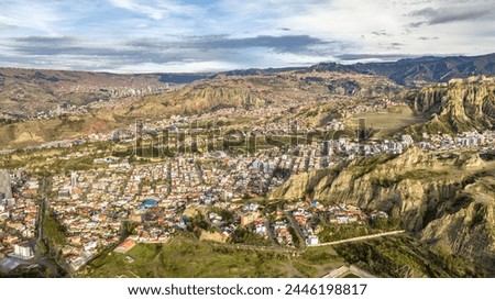 La Paz, Bolivia, aerial view flying over the dense, urban cityscape. San Miguel, southern distric. South America Royalty-Free Stock Photo #2446198817