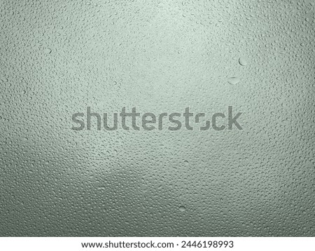 A picture of raindrops in the window on a rainy day