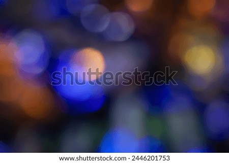 Defocused neon glow. Overlay of light highlights. Futuristic abstract LED illumination. Blur of neon colors on dark abstract background
