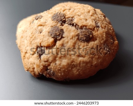 Alone cookies missing friend on  gray background. 