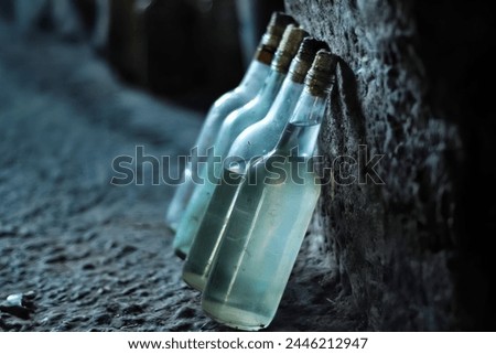 Boukha is a clear, colorless Tunisian spirit that is distilled from fermented figs Royalty-Free Stock Photo #2446212947