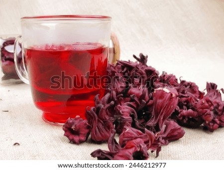 Jus de bissap - Roselle juice - Hibiscus Juice is an aromatic, slightly sour beverage that is the national drink of Senegal Royalty-Free Stock Photo #2446212977