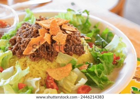 Taco rice, an Okinawan dish with taco ingredients placed on top of rice Royalty-Free Stock Photo #2446214383