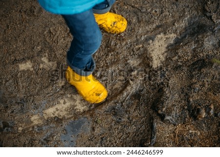 
rubber boots in the spring muddy ground