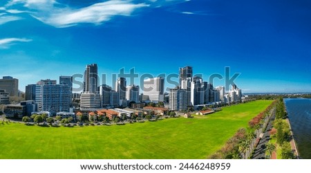 Perth skyline, Western Australia. Beautiful aerial view of city skyline along the river. Royalty-Free Stock Photo #2446248959