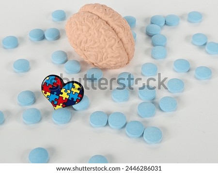 Autism medical pills and brain anatomy. Drug treatment for childhood autism concept Royalty-Free Stock Photo #2446286031