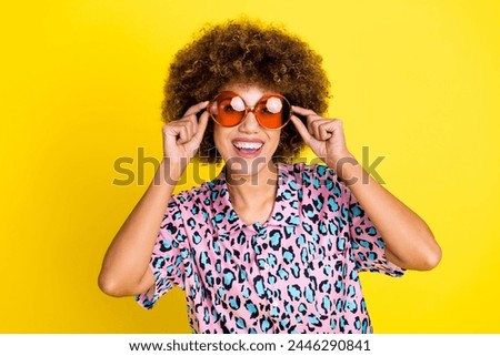 Photo of cool cheerful lady dressed leopard print shirt arms sunglass smiling isolated yellow color background