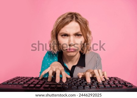 Photo portrait of pretty young girl moody web camera typing keyboard wear trendy striped cyan outfit isolated on pink color background