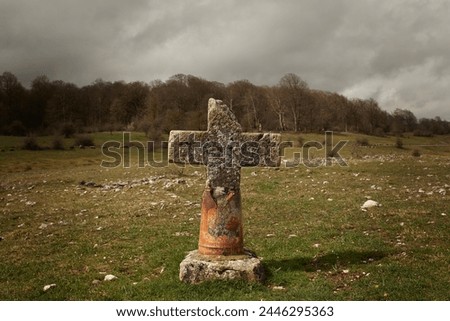 A stone cross in Urbasa Sierra in a cloudy day