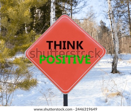 Think positive symbol. Concept words Think positive on beautiful red road sign. Beautiful forest snow blue sky background. Business, motivational think positive thinking concept. Copy space. Royalty-Free Stock Photo #2446319649
