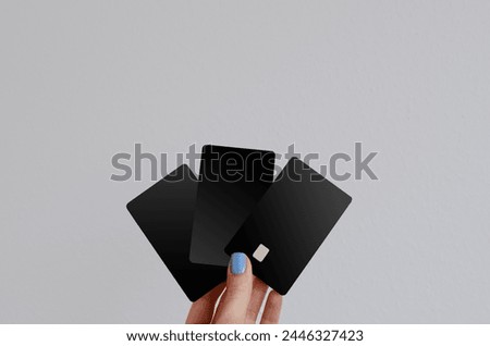 girl holding bank cards in her hands