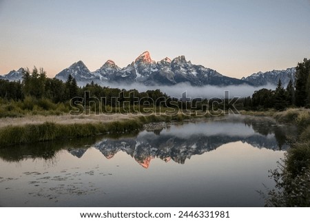 Grand Tetons, Wyoming, USA, Sunrise Landscape, Majestic Peaks, Teton Range, Rocky Mountains, Scenic Beauty, Outdoor Photography, Nature Photography, Golden Hour, Morning Glow, Spectacular View, River Royalty-Free Stock Photo #2446331981