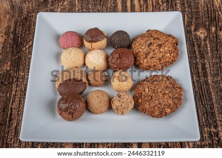 Biscuits , Dry Cake, Cookies Biscuits photoshoot picture. Vegan homemade truffles. Various dried cakes on wooden table.