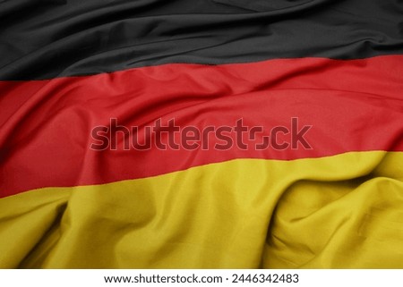 waving colorful national flag of germany. macro shot